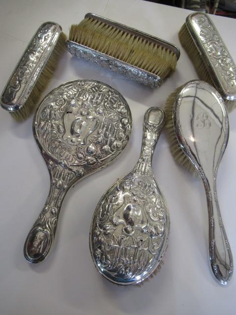SILVER BACKED HAND MIRROR AND SIX BRUSHES Image