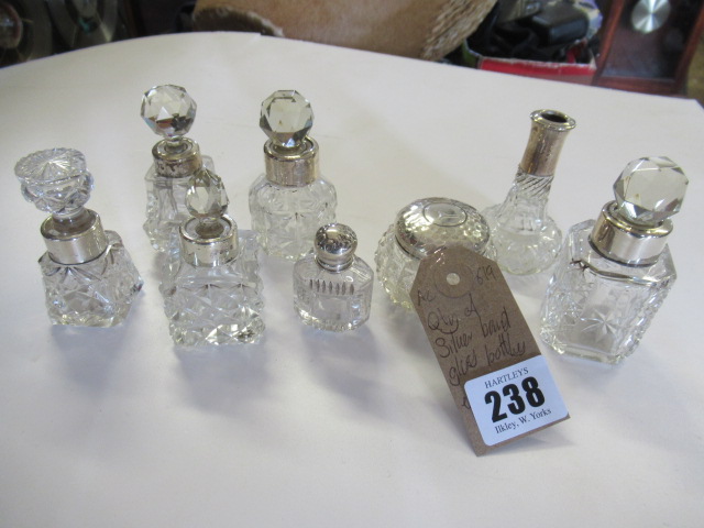 QUANTITY OF SILVER MOUNTED GLASS BOTTLES ETC Image