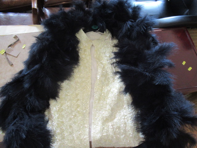 CREAM SEQUIN EVENING CAPE AND A FEATHER BOA Image