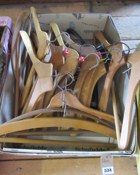 BOX OF WOODEN COAT HANGERS Image