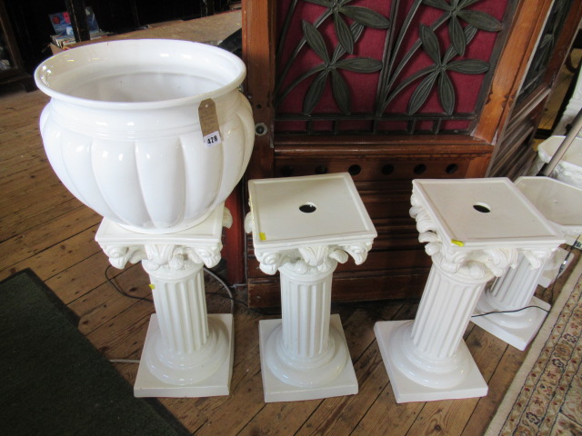 SET OF THREE POTTERY PLINTHS AND A JARDINIERE Image