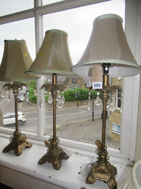 THREE GILT METAL TABLE LAMPS Image
