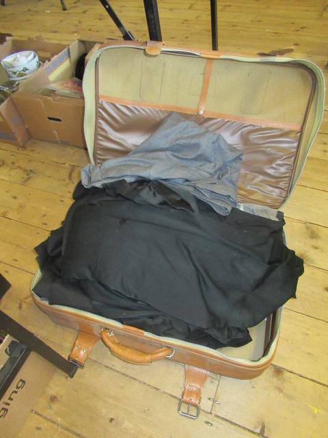 SUITCASE OF CLOTHING Image