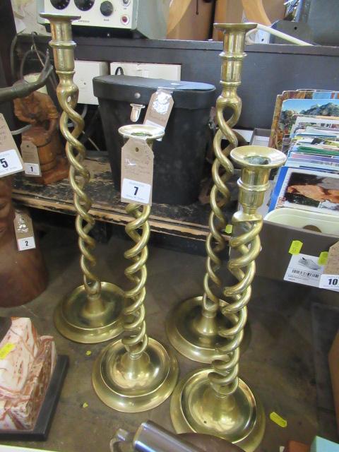 TWO PAIRS OF BRASS TWIST CANDLESTICKS Image