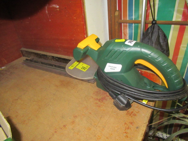 ELECTRIC HEDGE TRIMMER AND A GARDEN SPRAYER Image