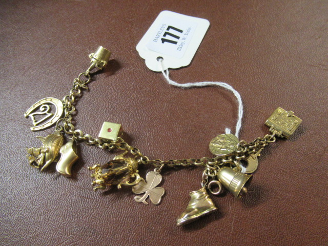 9CT GOLD BRACELET WITH TWELVE 9CT GOLD CHARMS Image