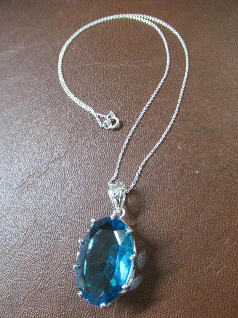 SILVER AND BLUE TOPAZ PENDANT ON SILVER CHAIN Image