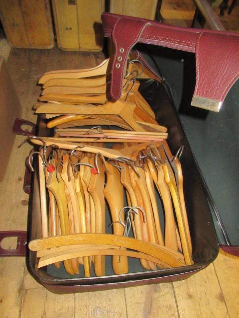 SUITCASE OF WOODEN COAT HANGERS Image