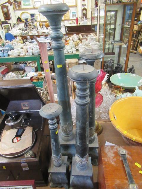 FOUR WOODEN CANDLESTICKS Image