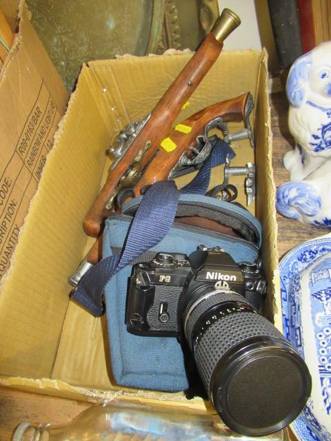 NIKON FG CAMERA AND TWO REPRO FLINTLOCK PISTOLS Image