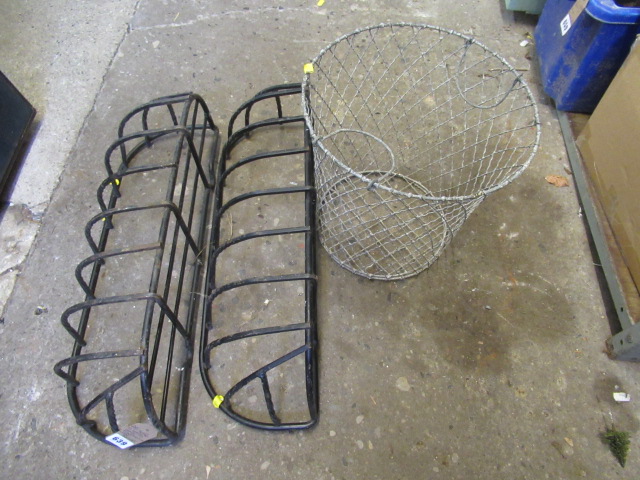 TWO METAL WALL PLANTERS AND A WIRE BASKET Image