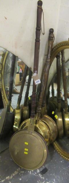 THREE BRASS BED WARMERS Image