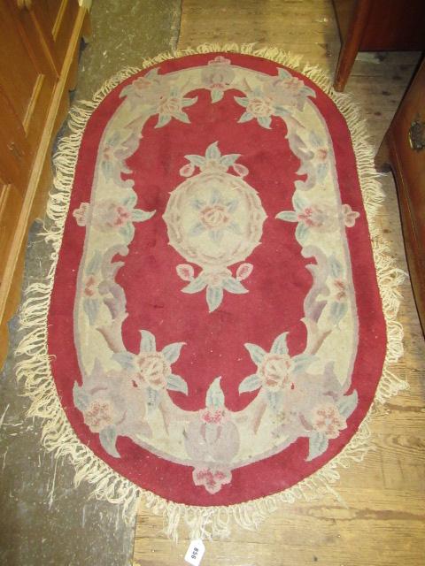 RED OVAL RUG Image
