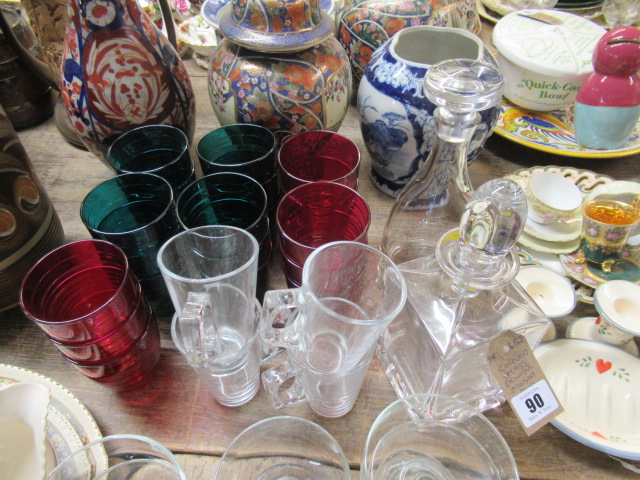 COLOURED GLASS DRINKING GLASSES AND TWO DECANTERS Image