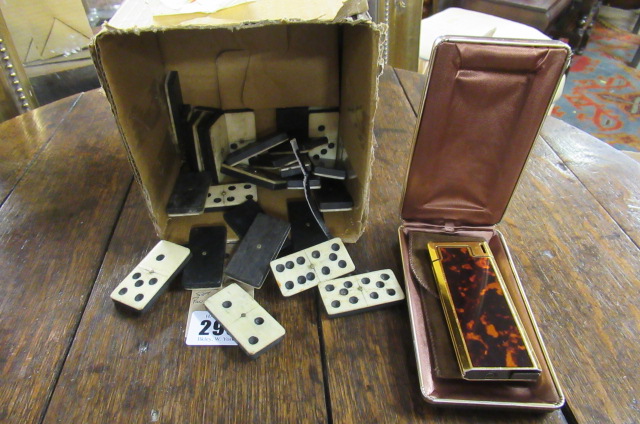POCKETMAN LIGHTER/CALCULATOR AND SET OF BONE AND EBONY DOMINOES Image