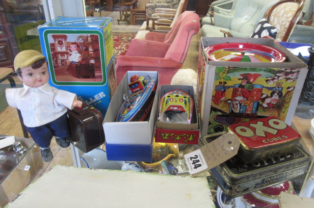 TIN PLATE TOYS AND TWO VINTAGE TINS Image
