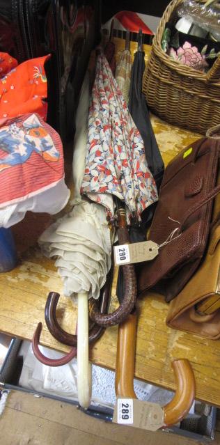 FOUR UMBRELLAS AND A PARASOL Image