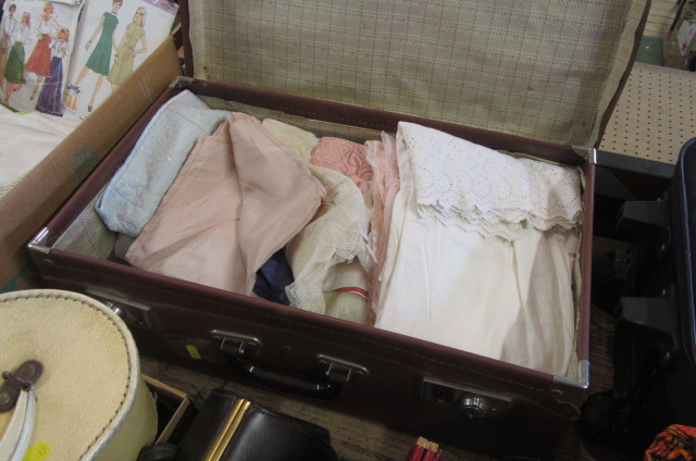 SUITCASE OF LINENS ETC Image