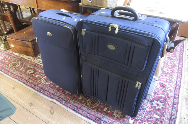 THREE SUITCASES AND A BAG Image