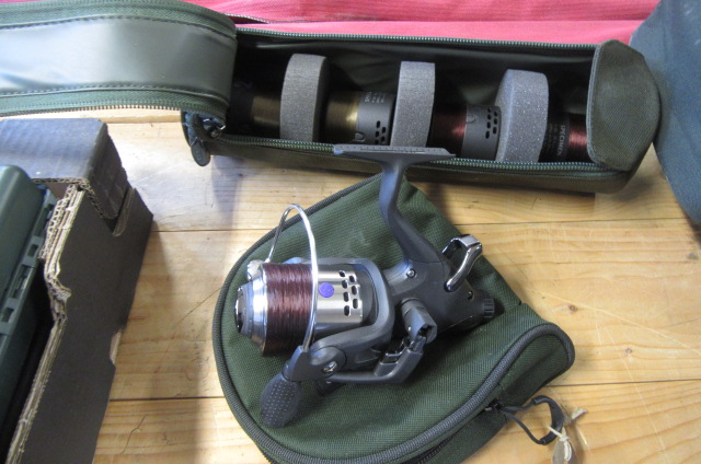 CASED FISHING REEL AND CASED SPOOLS Image