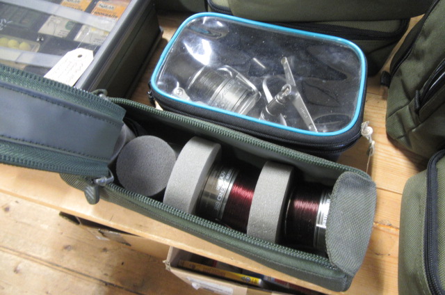 CASED FISHING REEL AND CASED SPOOLS Image