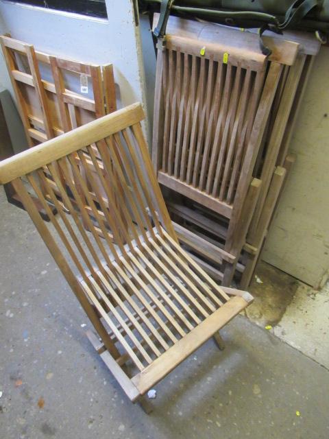 FOUR HARD WOOD FOLDING CHAIRS Image