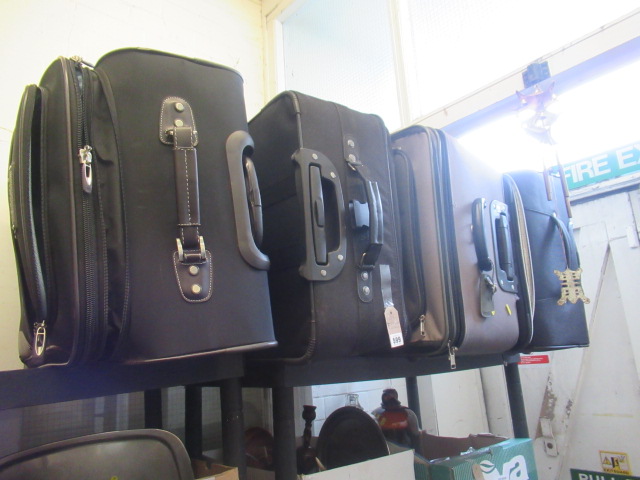 FIVE SUITCASES AND CONTENTS Image