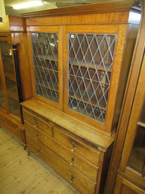 OAK LEADED GLAZED BOOKCASE ON CHEST Image