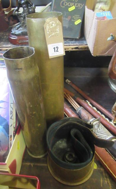 THREE BRASS SHELL CASES Image