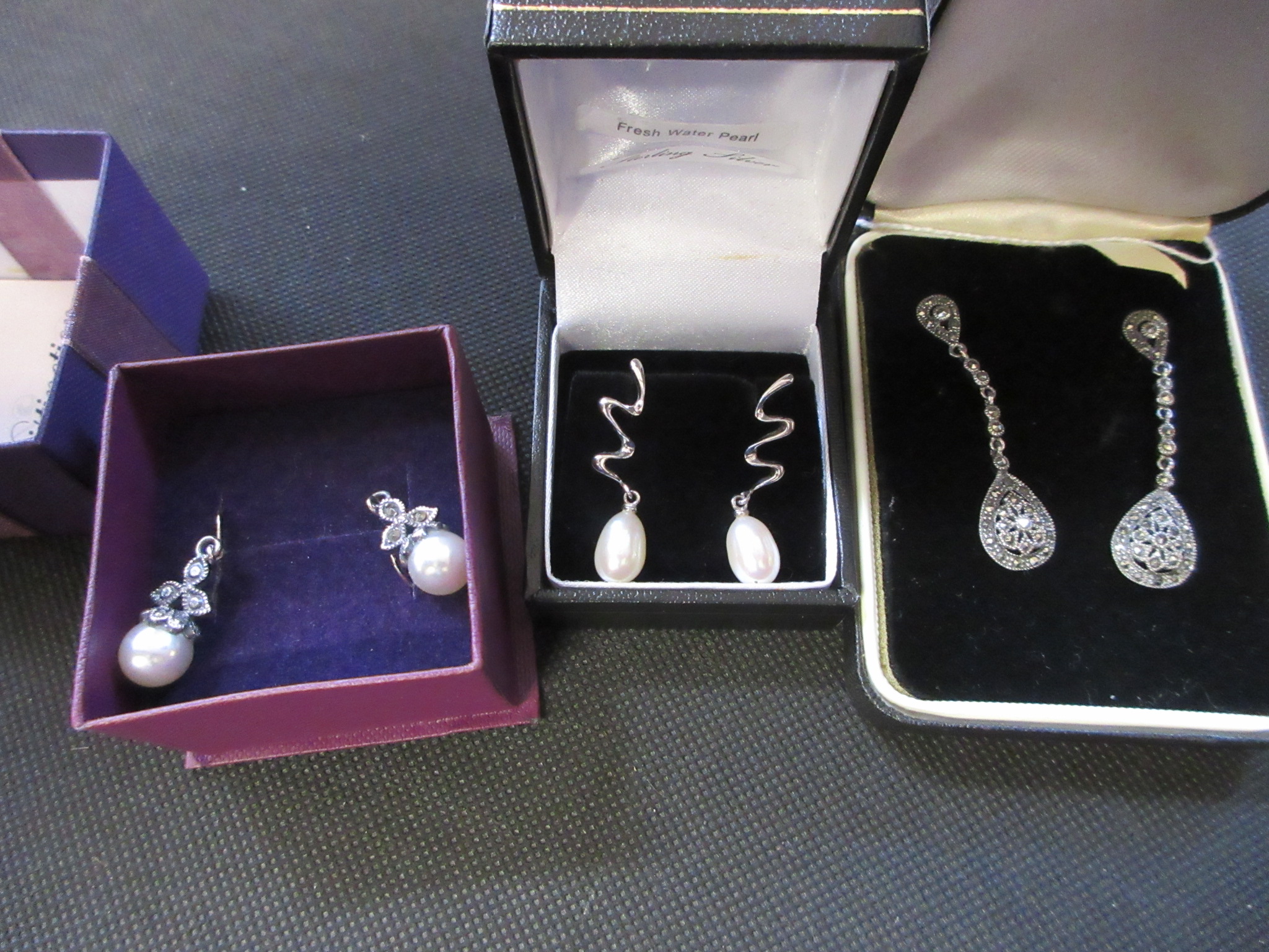 THREE PAIRS OF SILVER EARRINGS Image