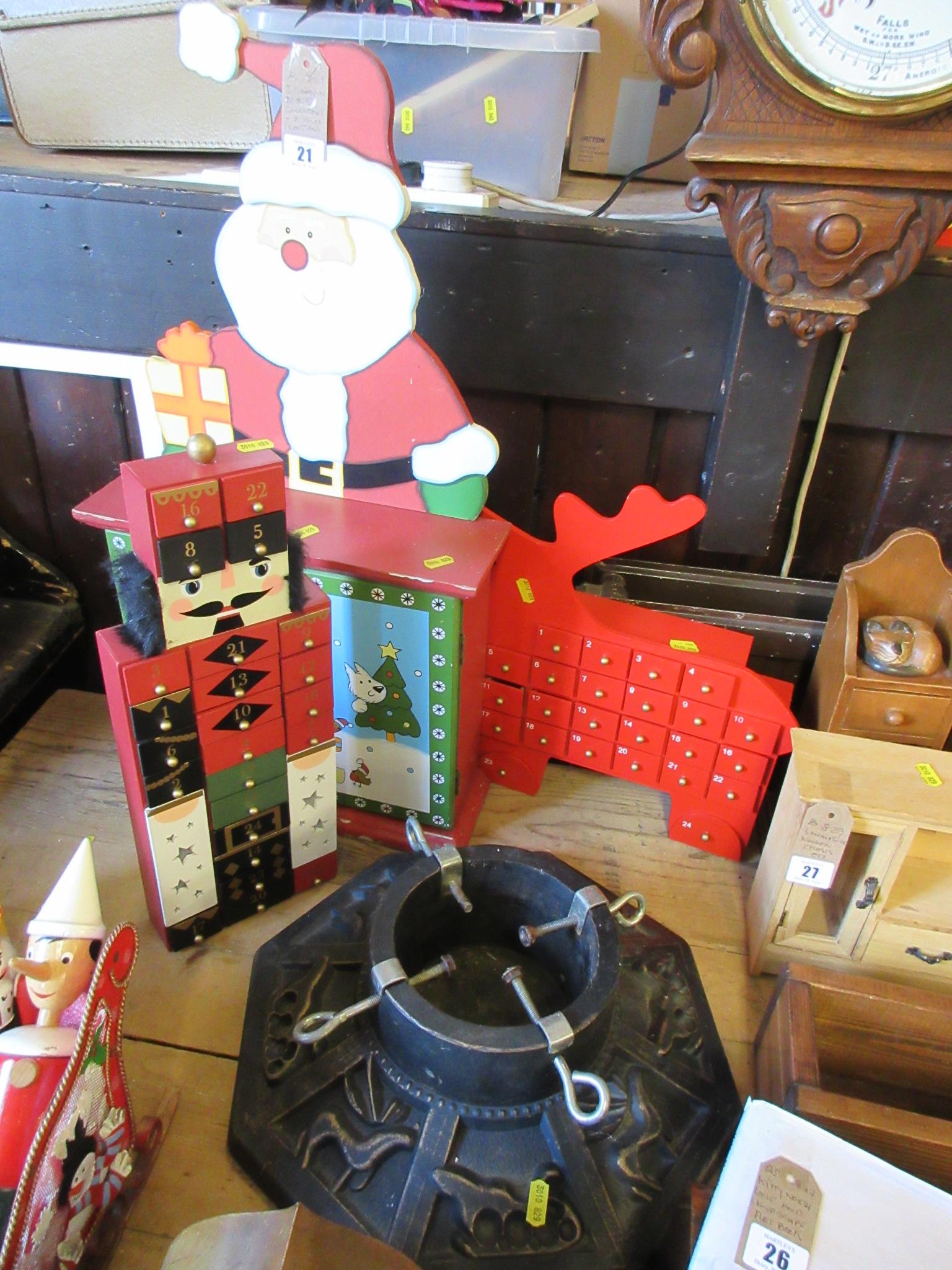 THREE WOODEN ADVENT CALENDARS AND A CHRISTMAS TREE STAND Image