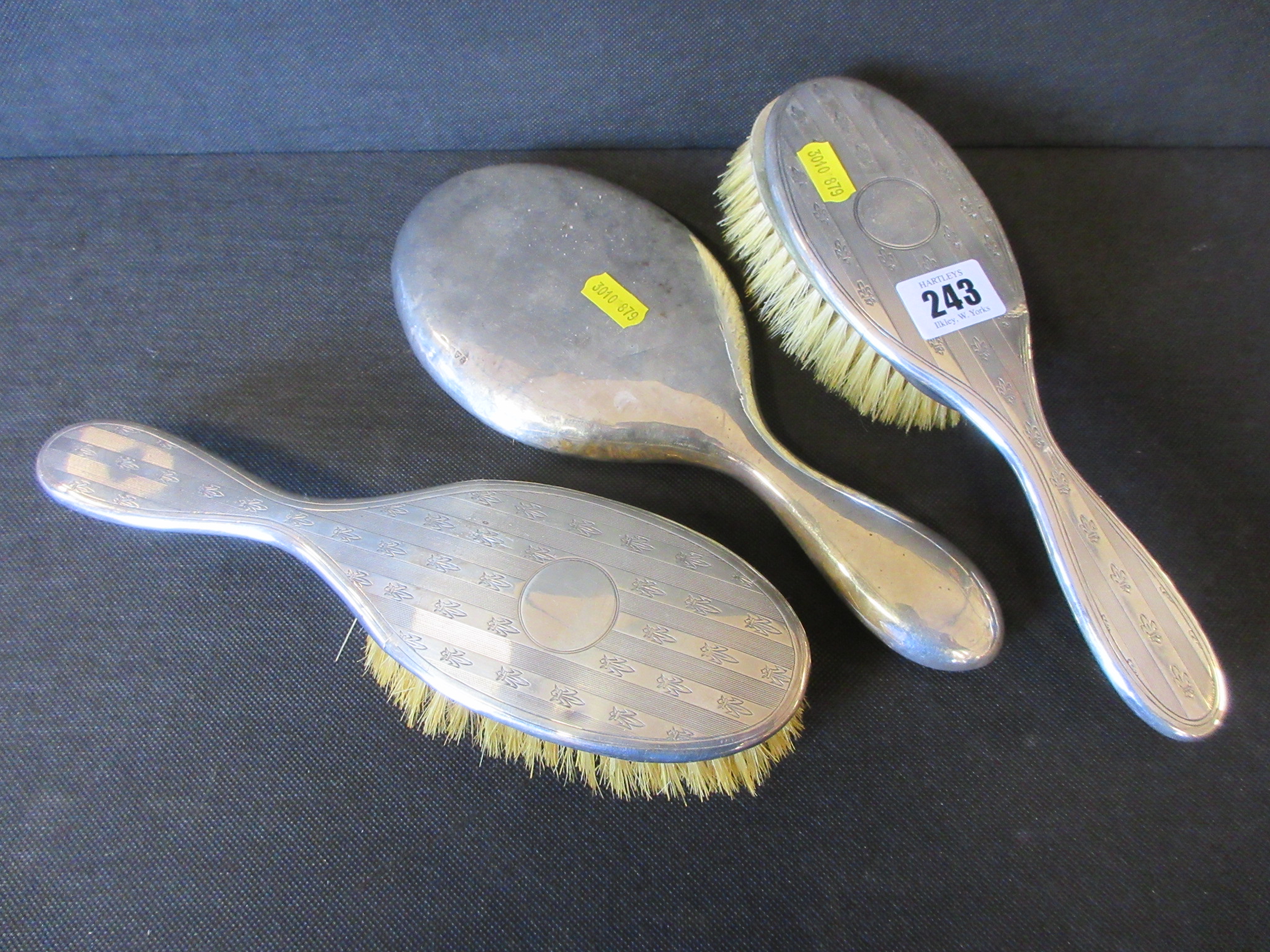 SILVER BACKED HAND MIRROR AND TWO BRUSHES Image
