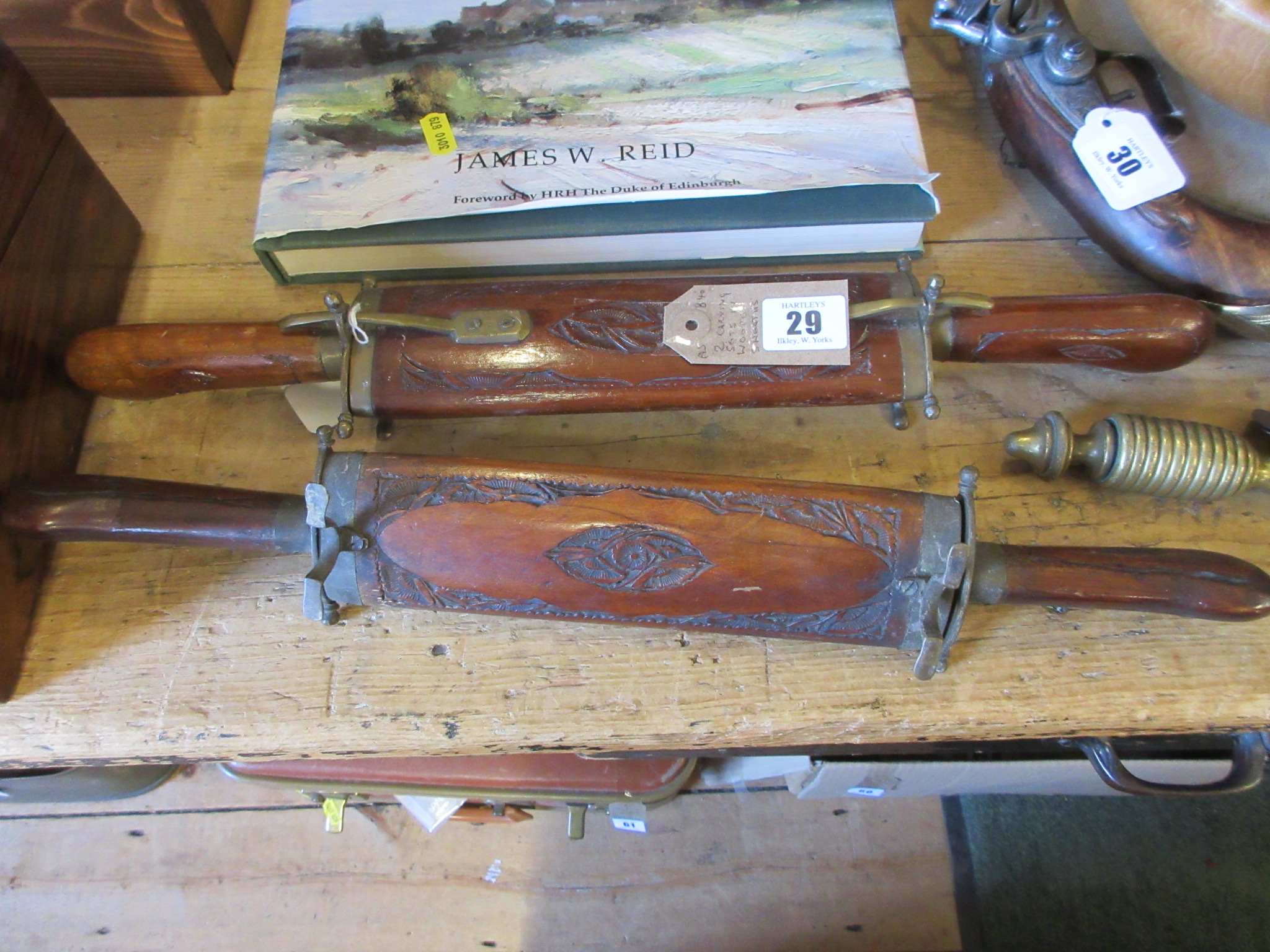 TWO CARVING SETS IN WOODEN SHEATHS Image