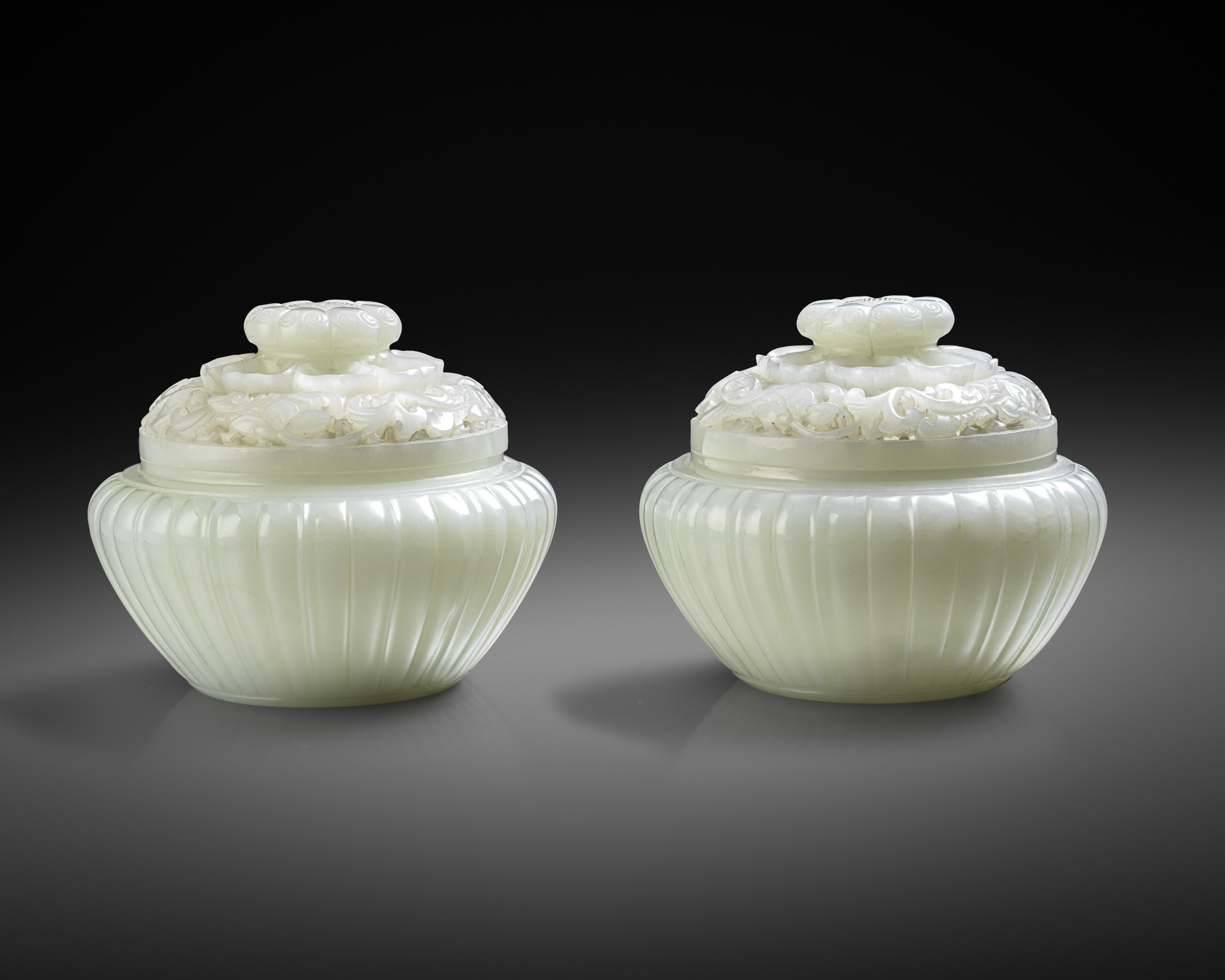 AN EXCEPTIONAL PAIR OF FINE CHINESE IMPERIAL WHITE JADE JARS AND COVERS