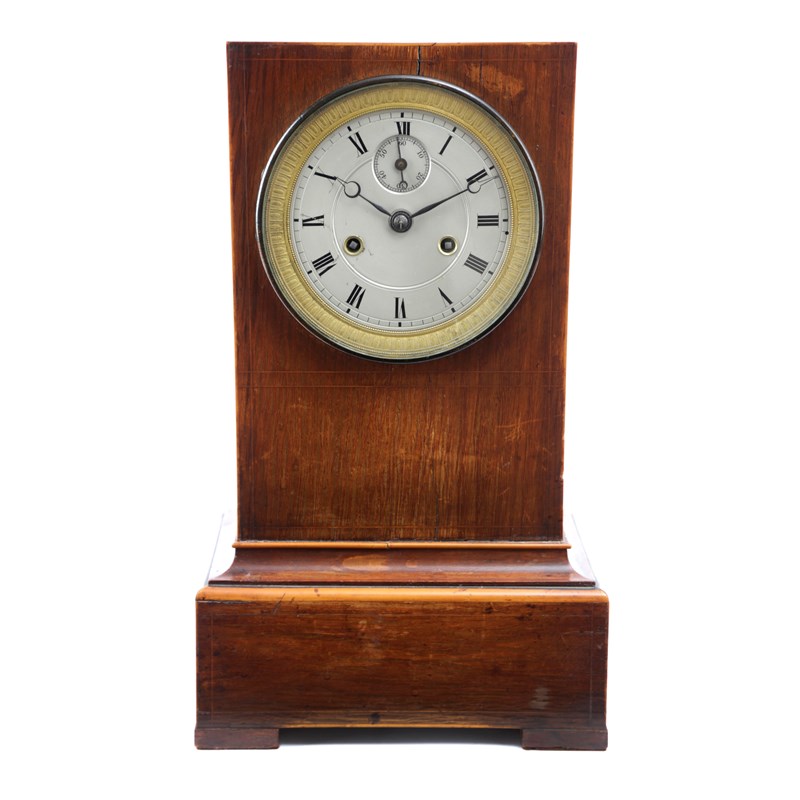 Λ a french rosewood mantel clock Woolley and Wallis