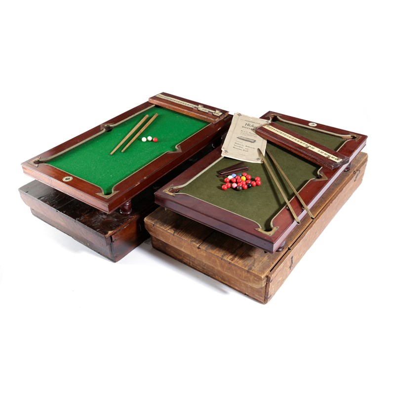 A mahogany and brass mounted miniature billiards table Woolley and Wallis