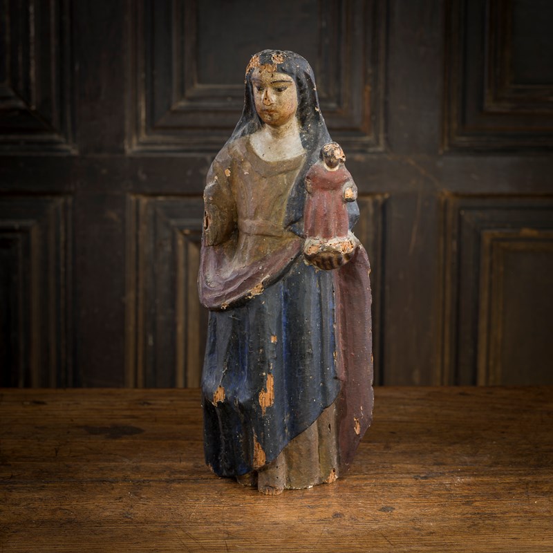 A 17th century carved softwood and polychrome-decorated figure group ...