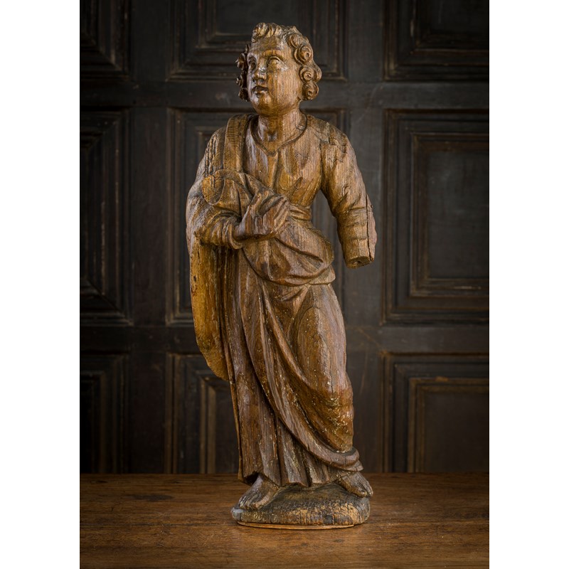 A 16th century carved oak figure of a male saint, flemish, circa 1550 ...