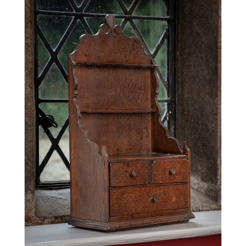 A george iii oak spoon rack, with drawers, circa 1770 | Woolley and Wallis