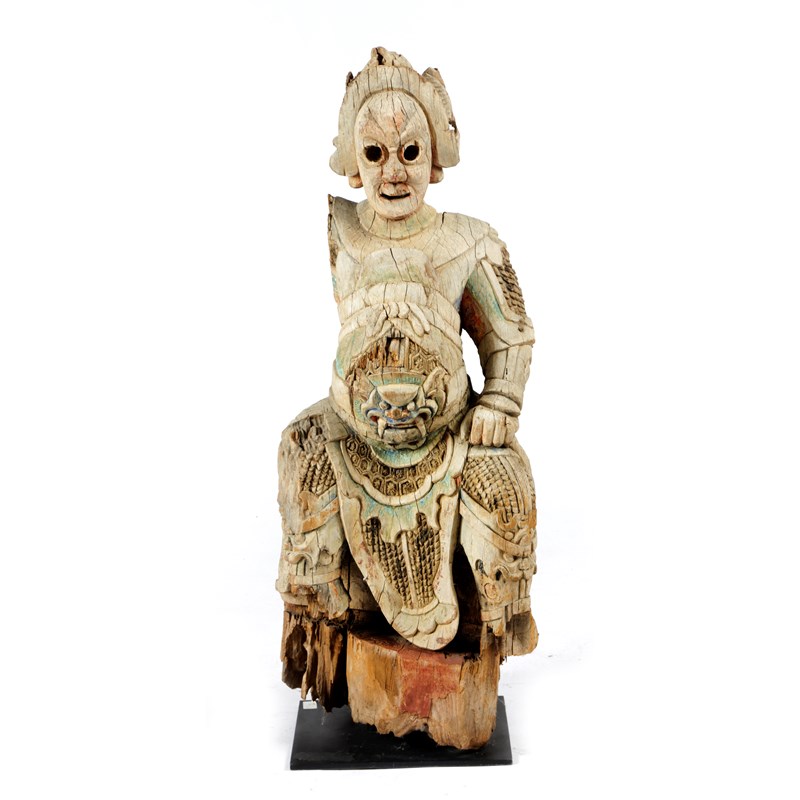 A chinese carved wood figure of a warrior | Woolley and Wallis