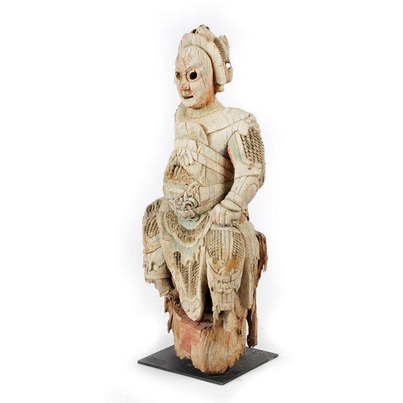 A chinese carved wood figure of a warrior | Woolley and Wallis