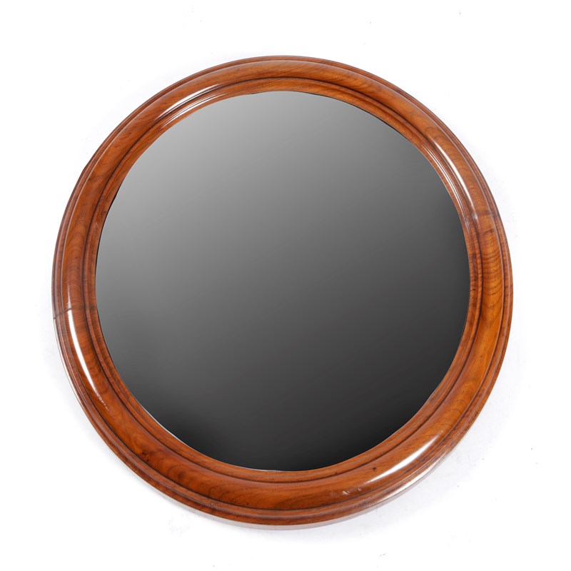 A victorian walnut convex wall mirror | Woolley and Wallis