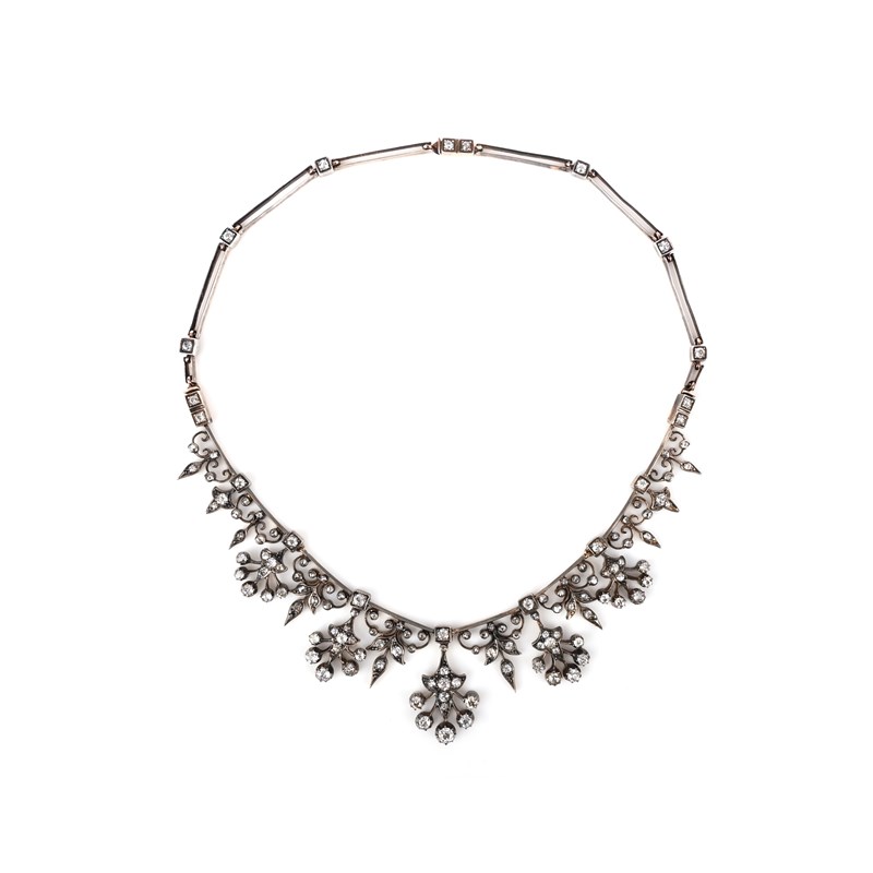 A diamond tiara/necklace and earrings | Woolley and Wallis