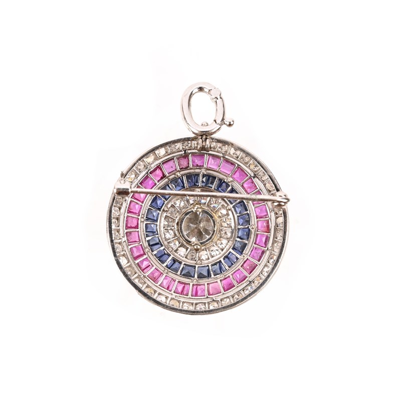 Alexander Ritchie Target Brooch A sapphire, ruby and diamond target brooch pendant | Woolley and Wallis
