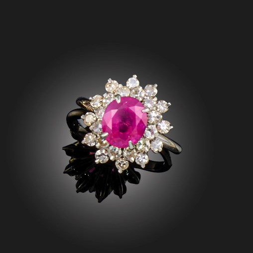 A ruby and diamond cluster ring | Woolley and Wallis