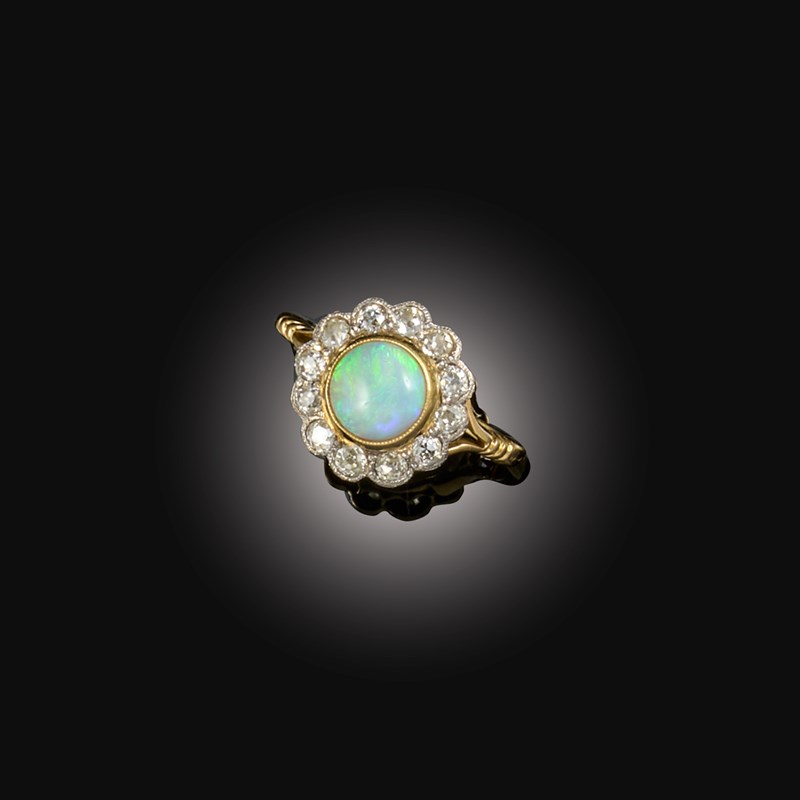An opal and diamond cluster ring | Woolley and Wallis
