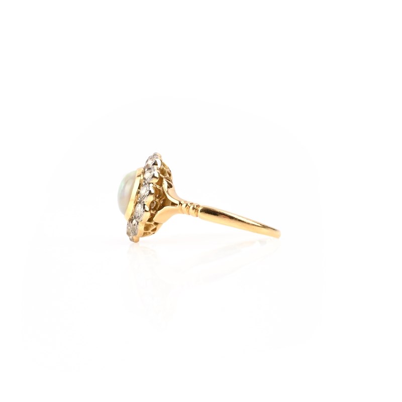 An opal and diamond cluster ring | Woolley and Wallis