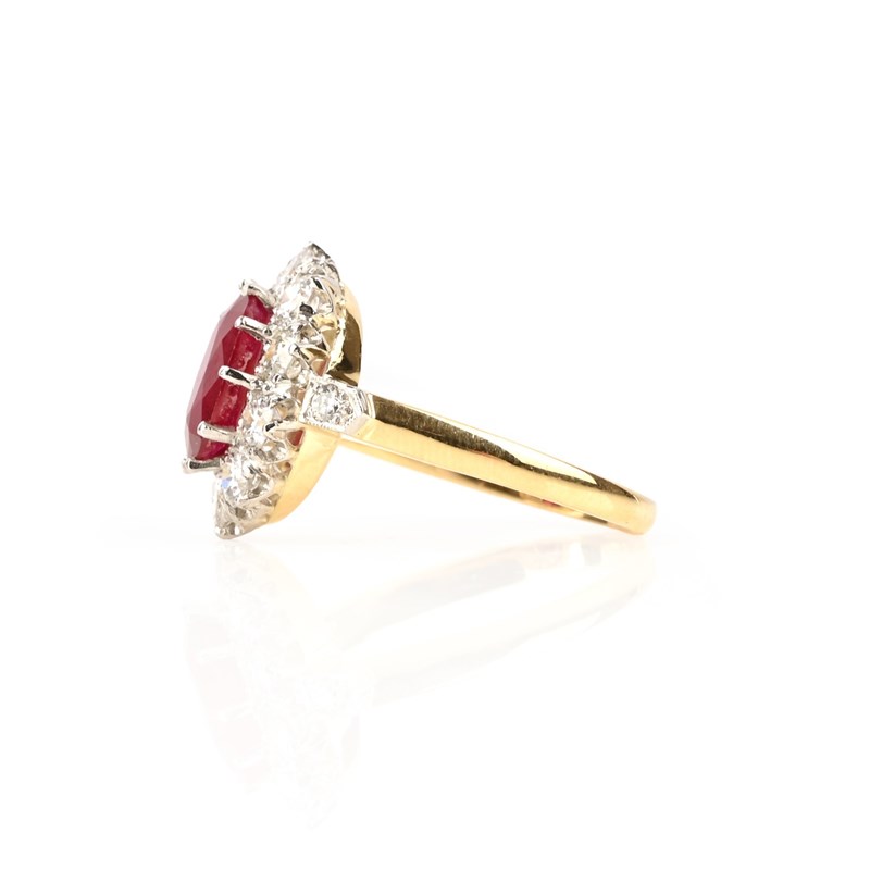 A ruby and diamond cluster ring | Woolley and Wallis