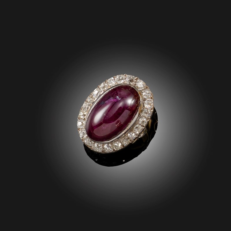 A ruby and diamond cluster ring | Woolley and Wallis