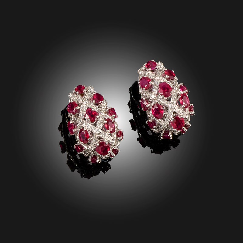 A pair of ruby and diamond earclips | Woolley and Wallis